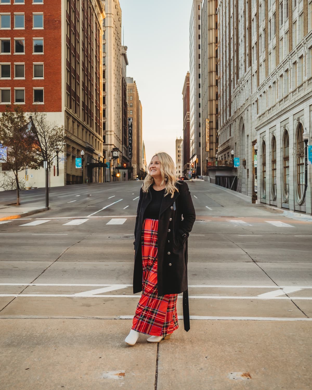 Amanda, co-owner of InterPeak, standing in a downtown Tulsa intersection